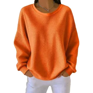 Women's casual orange waffle knit crewneck sweatshirt with long sleeves