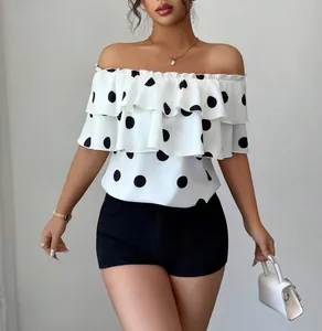 Stylish women's off-the-shoulder white blouse featuring large black polka dots and ruffles