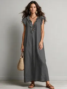 Full-length bohemian grey maxi dress featuring elegant flutter sleeves and ruffles