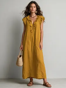 Vibrant mustard yellow bohemian maxi dress with ruffle V-neck and flutter sleeves for summer