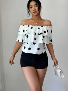 Elegant white polka dot off-the-shoulder ruffle blouse for a casual summer vacation