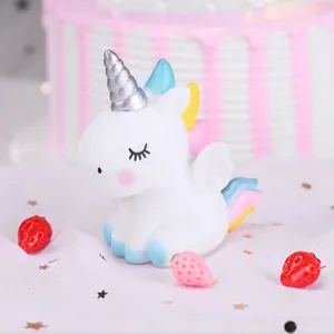 Cute vinyl unicorn cake topper with rainbow mane and silver horn for birthday.