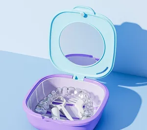 Portable dental braces box with mirror showing inner storage space and aligner tools