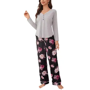 Two-piece floral print pajama set with grey long-sleeve top and rose pattern pants