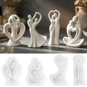 Silicone DIY molds for abstract couple figurines with finished resin statues shown