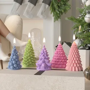 Five colorful Christmas tree shaped candles in a festive holiday home setting