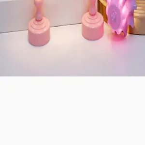 Detailed view of pink lily of the valley mini night lights on a decorative table