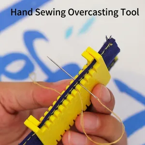 Close-up view of a manual plastic sewing guide tool being used for precise edge stitching
