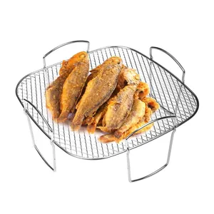 Stainless steel square air fryer rack with mesh surface and four legs for grilling