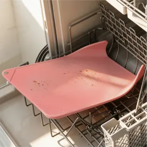 Flexible pink PP cutting board shown in a dishwasher rack, dishwasher safe kitchen mat