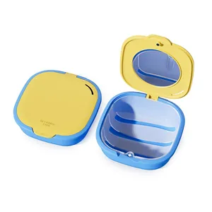Portable blue and yellow magnetic aligner storage case with built-in mirror and drain