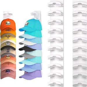 Detailed view of white wall-mounted hat organizer showing storage capacity for caps