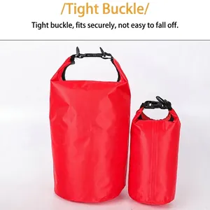 Set of two red PVC waterproof dry bags with secure buckles for outdoor rafting and swimming
