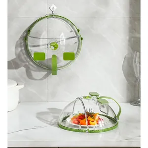Heat resistant microwave food cover with green handle and splash guard for kitchen use