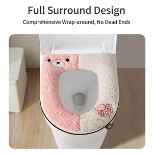 Plush color-blocked toilet seat cover with cute teddy bear and paw print design.