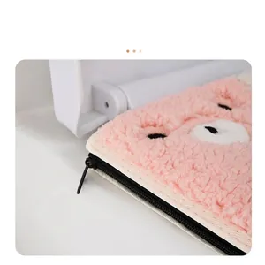 Plush pink toilet seat cover with cute bear embroidery and smooth black zipper closure