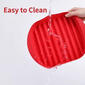 Red heat-resistant silicone bacon baking tray with ribbed surface for easy grease drainage