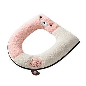 Soft plush pink and white bear-themed toilet seat cover with handle for winter warmth
