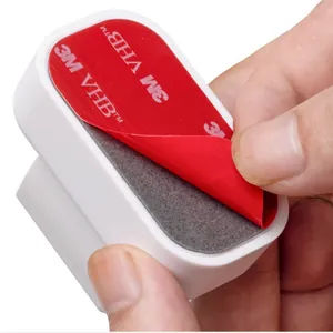 Heavy duty 3M VHB adhesive tape detail on a wall mounted white toothbrush holder bracket