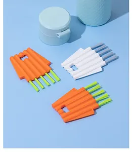 Set of orange and white creative gap cleaning brushes for bottle lids and crevices