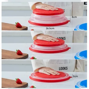 Red collapsible silicone microwave food cover with vent holes 26.5cm diameter lid