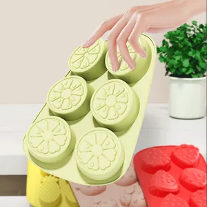 Set of colorful silicone fruit-shaped ice cube molds with lemon and strawberry designs
