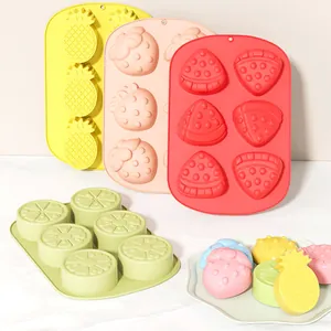 Assorted silicone fruit-shaped ice cube molds including strawberry watermelon pineapple