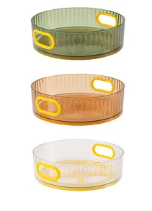 Detailed view of rotating cosmetic organizers in green, orange, and transparent colors