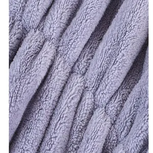 Close-up of soft purple absorbent microfiber fleece texture for quick-dry hair towel