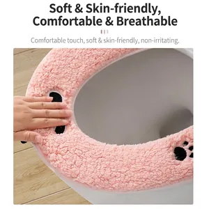 Coprisedile per WC in morbido peluche rosa con simpatico motivo a zampa per l'inverno