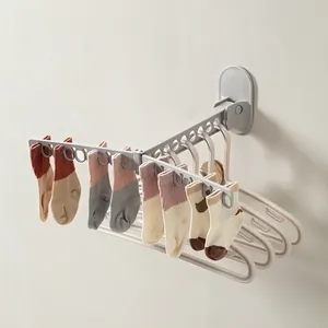 Foldable wall-mounted laundry drying rack with multi-hole design for drying socks