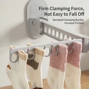 Wall-mounted folding sock drying rack with serrated clips for indoor clothes hanging