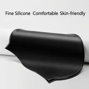 Detailed macro view showing the smooth texture of a black high-elasticity silicone swim cap