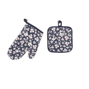 Floral print oven mitt and pot holder set for kitchen baking and heat protection. Blue.