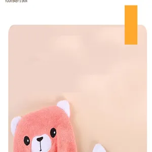 Close-up view showing the soft texture of a cartoon bear super absorbent hair drying cap