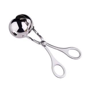 Durable stainless steel meatball maker tool with scissor-style handle for DIY kitchen use.