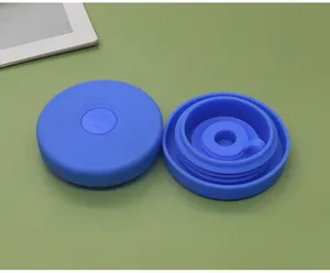 Detail view of blue silicone water bucket lids showing top and inner seal structure