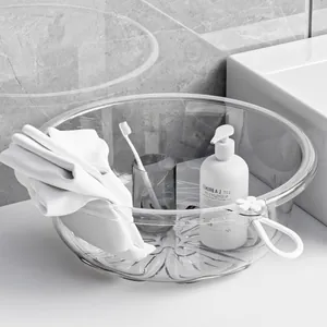 Large transparent round plastic washbasin with decorative cherry blossom pattern