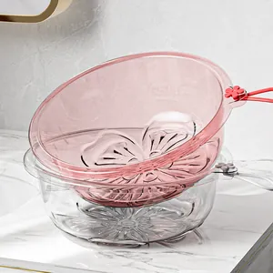 Elegant transparent pink sakura pattern washbasin with hanging hook on marble counter