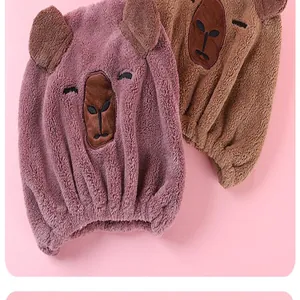 Close-up of microfiber cartoon bear hair drying towels in pink and brown