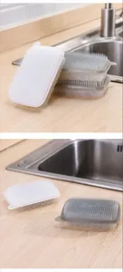 Close-up detail of the dual-sided silicone sponge brush for fruit and vegetable cleaning