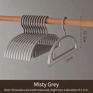 Detail view of grey children's clothes hangers showing 29cm width dimensions