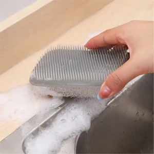 Dual-use kitchen sponge brush with silicone bristles for deep cleaning and scrubbing.