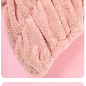 Close-up of the soft pink microfiber fabric of the quick-drying hair towel cap