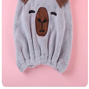 Detailed close-up showing the soft plush texture of a cartoon bear hair drying cap