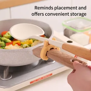 Creative silicone bunny spatula holder for pot rims, heat-resistant and anti-overflow.