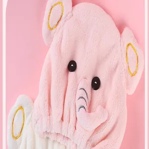 Close-up of pink cartoon elephant microfiber quick-dry hair cap showing soft texture
