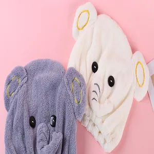 Close-up of cute cartoon elephant quick-dry hair caps in soft white and purple fleece.