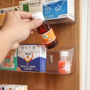 Clear wall-mounted acrylic storage box for medicine and small items.