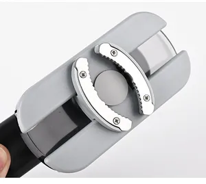 Close-up of adjustable stainless steel serrated jaws of a manual jar opener